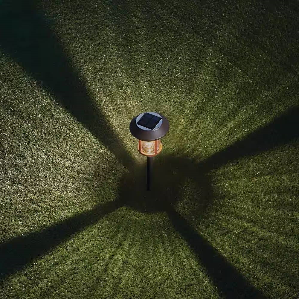Juego de 4 luces LED solares para exteriores en verde con estacas de tierra para jardín