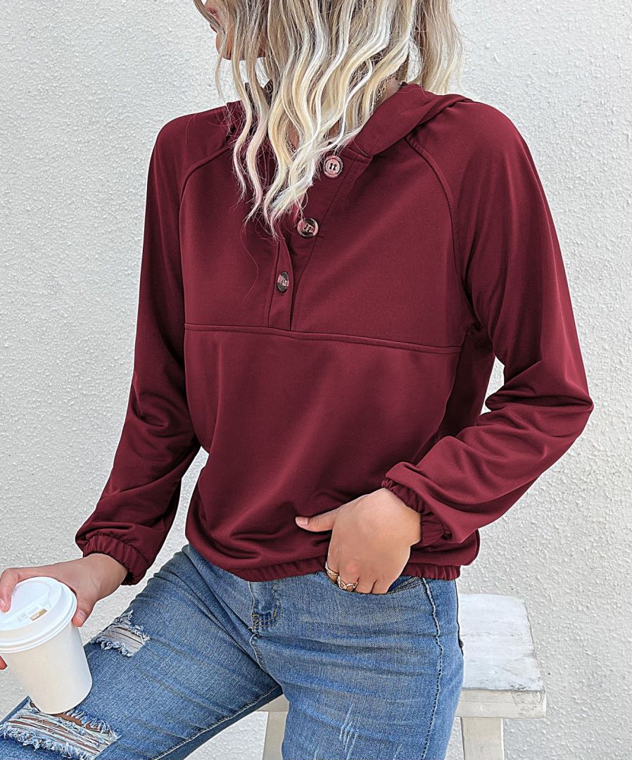 Sudadera con capucha y medio cierre de botones