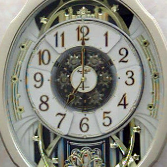 Reloj de pared con péndulo de cara móvil - Reproduce melodías cada hora
