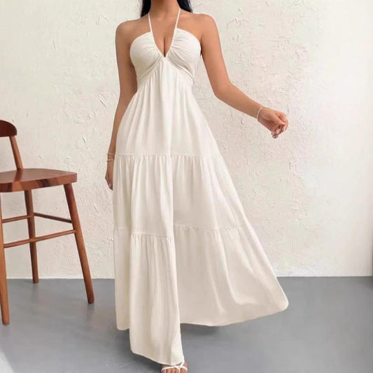 Vestido largo fluido con cuello halter y lazo en la espalda