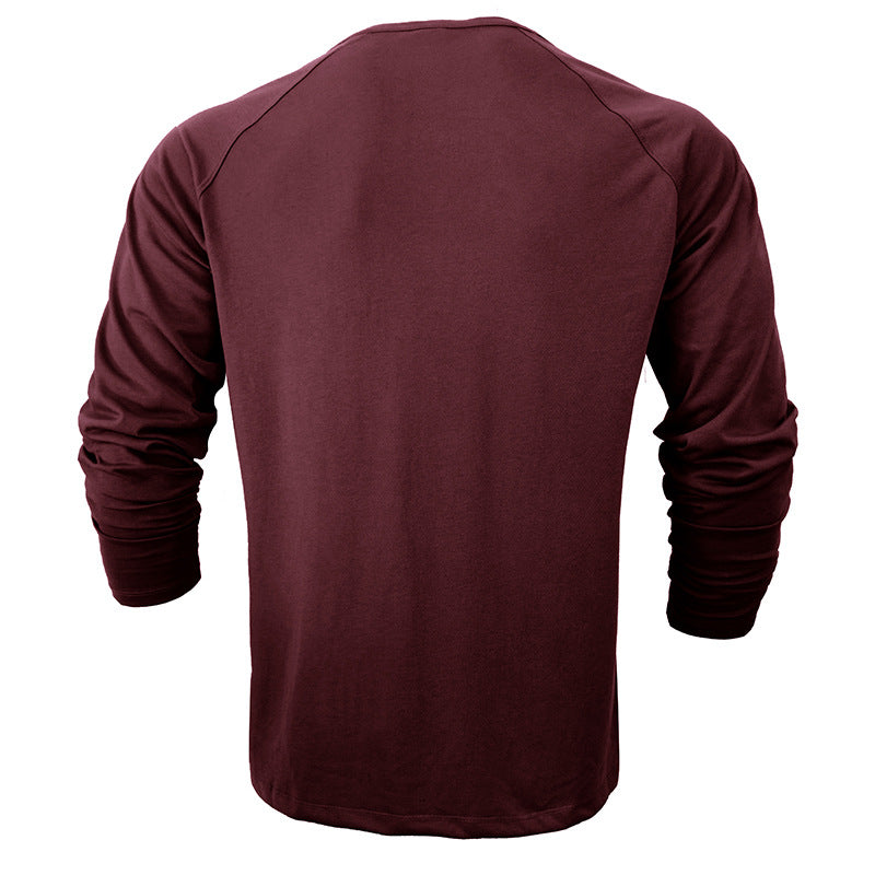 Camiseta de manga larga con cuello redondo Henley de color liso para hombre