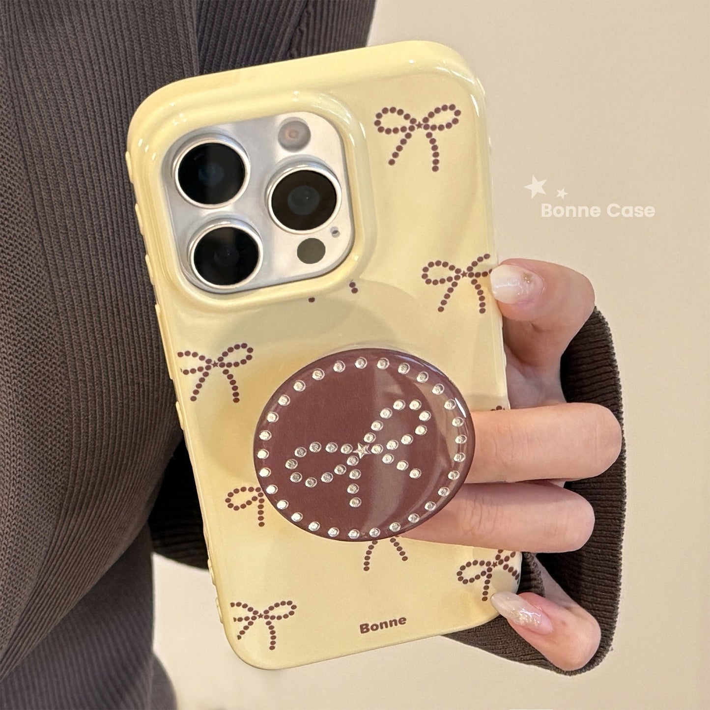 Soporte de lazo de lunares dorados, funda para móvil Apple 17 iphone16promax, apta para 14 personalidades 16 todo incluido.