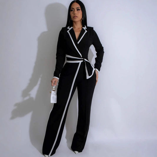 Mono de manga larga con retales bicolor y cinturón de diseño de moda