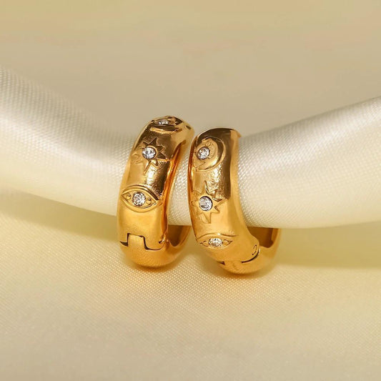 Pendientes de aro de acero inoxidable chapado en oro de 18 quilates XINGX con ojo de diablo, oxidación cúbica e incrustaciones de diamantes blancos