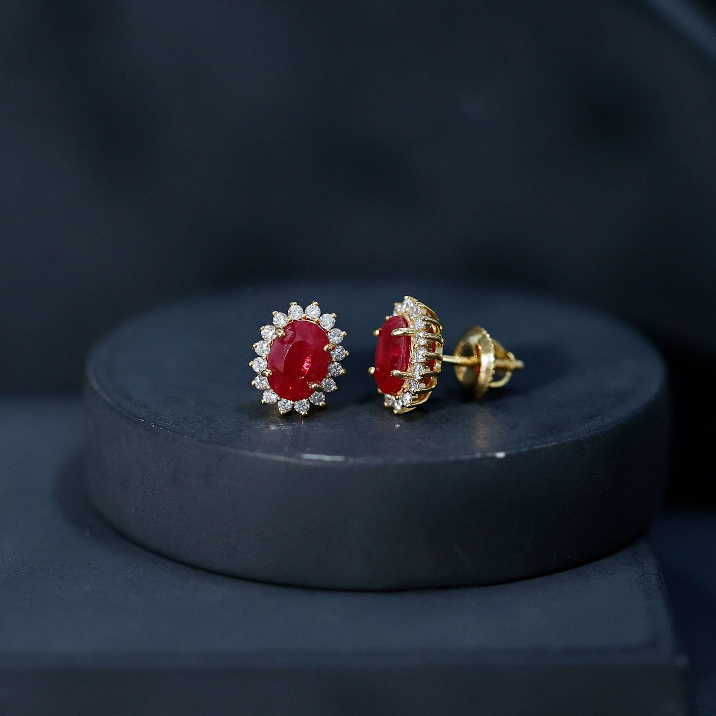 Natural 5X7 mm Oval Ruby Stud Earrings With Diamond Halo