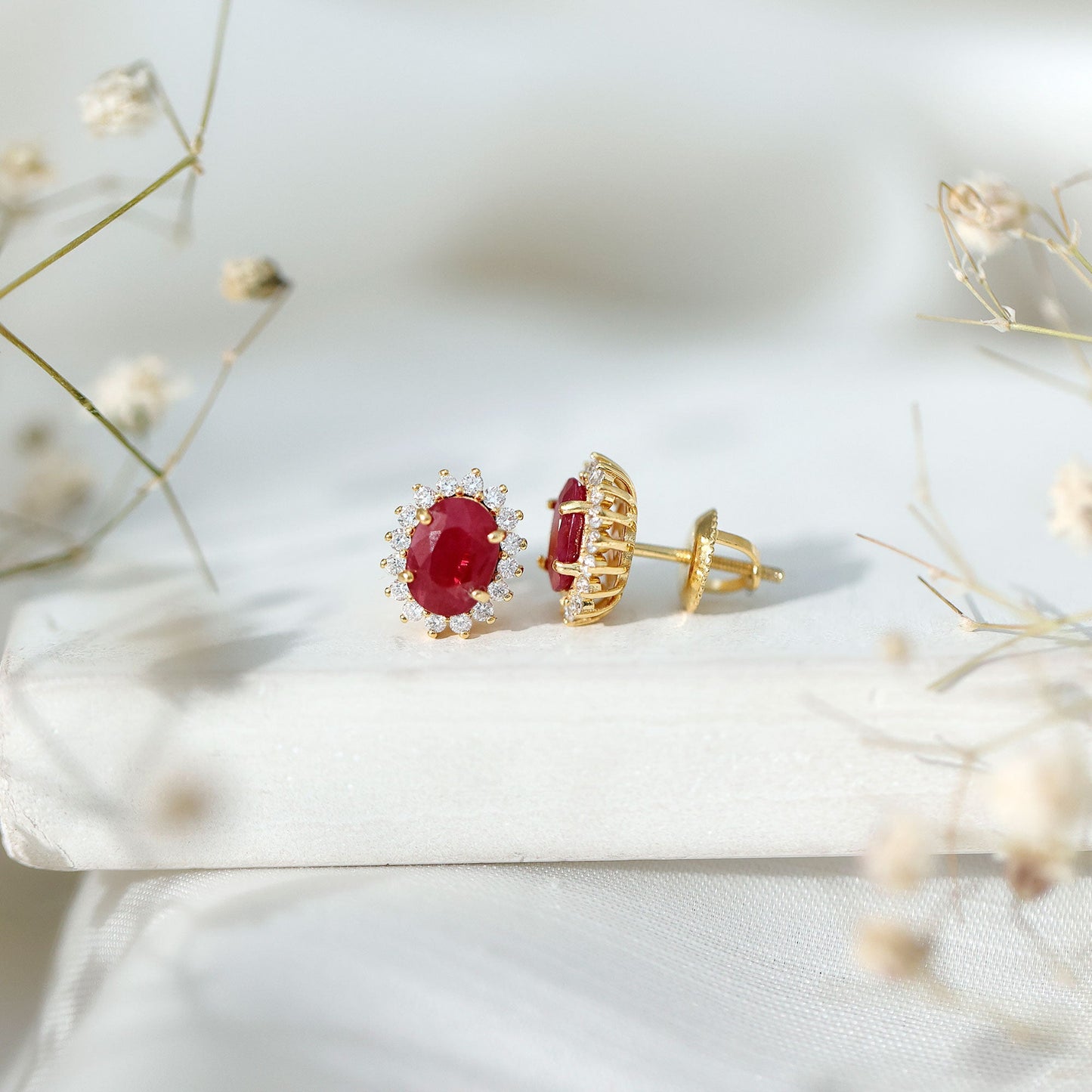 Natural 5X7 mm Oval Ruby Stud Earrings With Diamond Halo