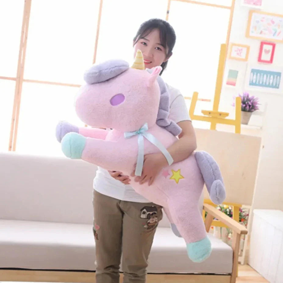 Peluche de unicornio en tonos pastel