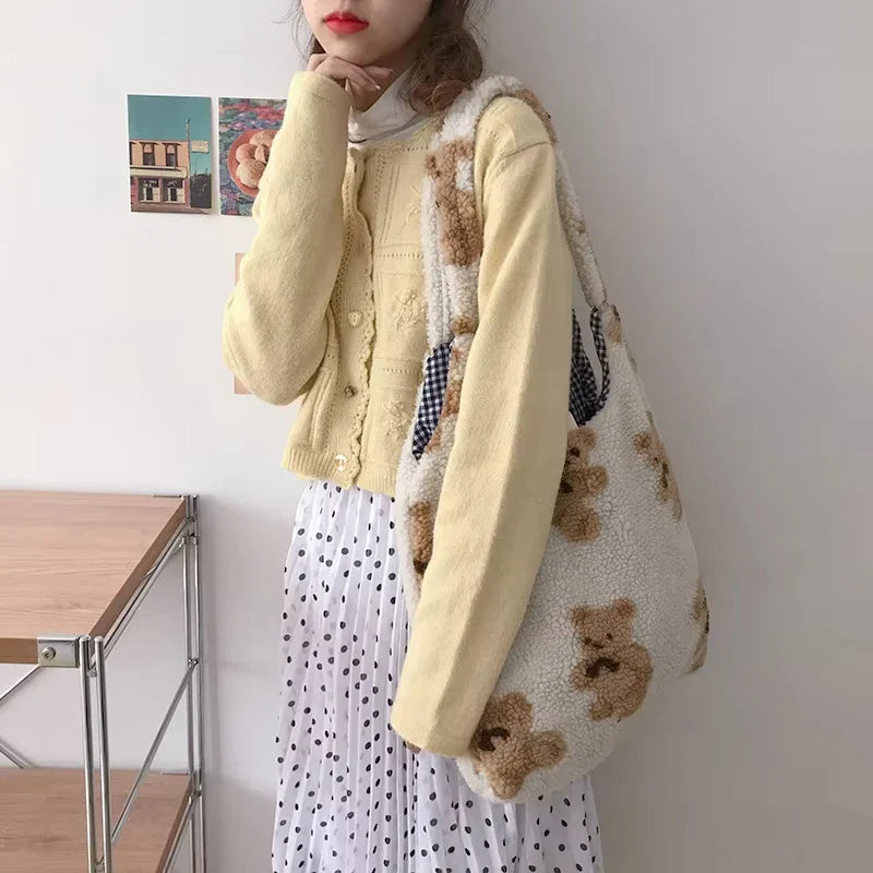 Bolso de mano con estampado de osito de peluche.