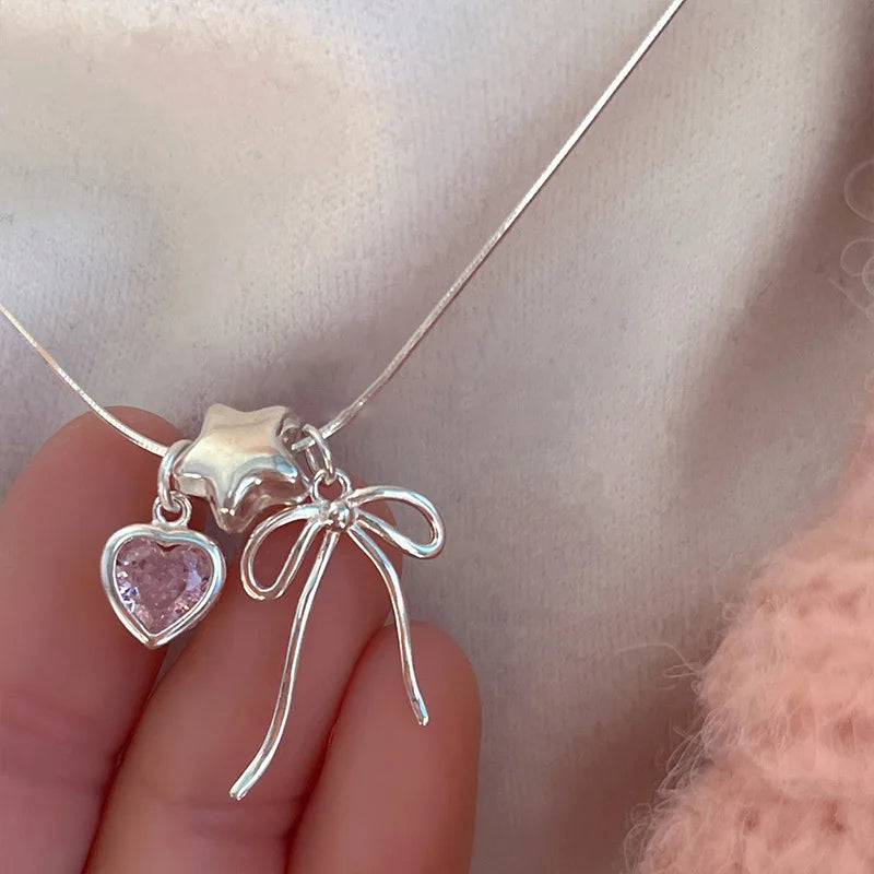 Pulsera y collar con diseño de estrellas, corazones y lazos