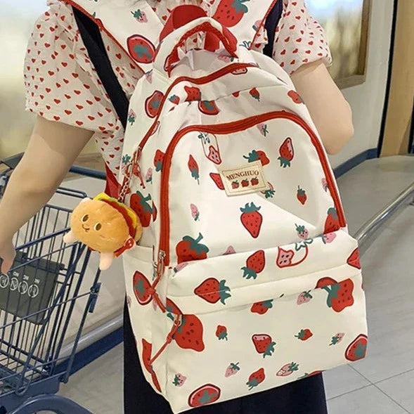 Mochila con estampado de fresas blancas y rojas