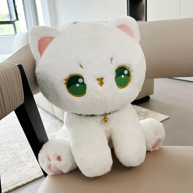 Peluche de gato con ojos verdes