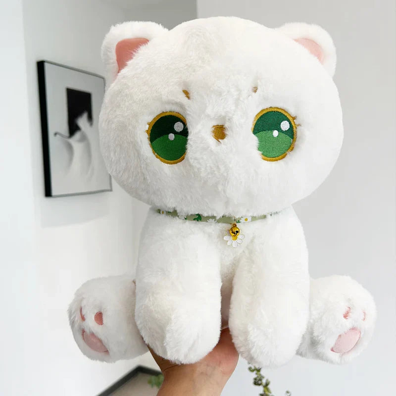 Peluche de gato con ojos verdes