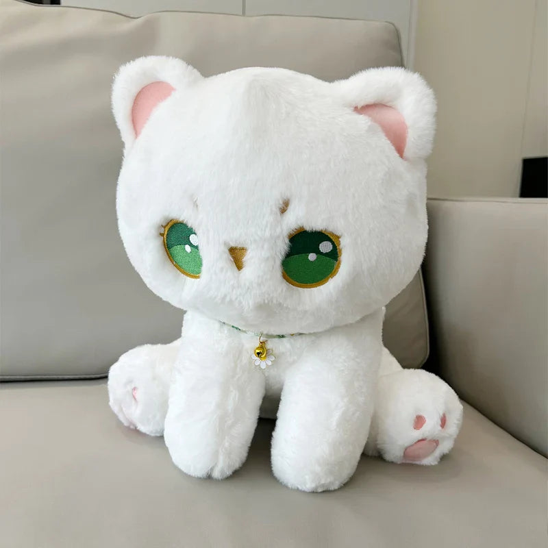 Peluche de gato con ojos verdes