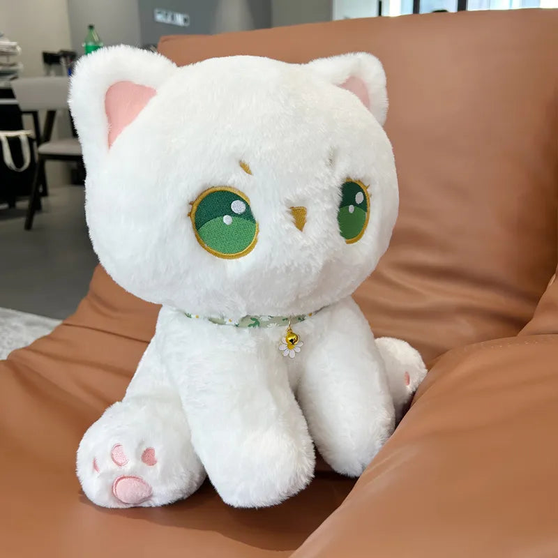 Peluche de gato con ojos verdes