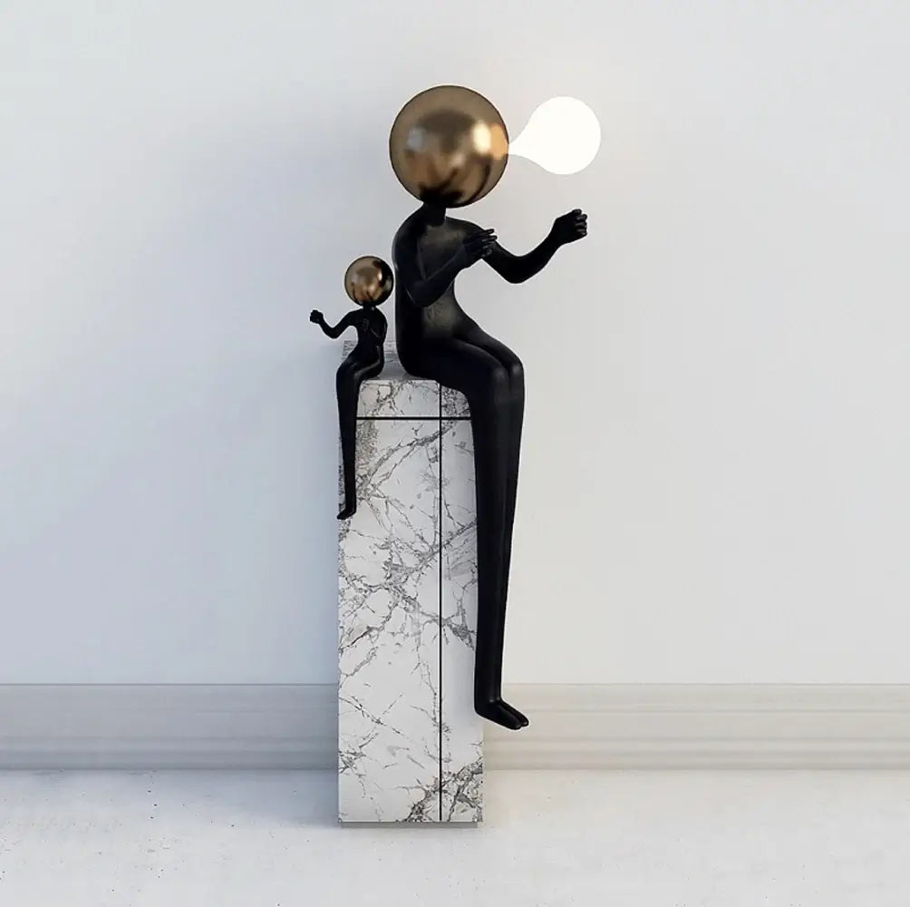 Lámpara de pie Escultura Doble Figura Sentada