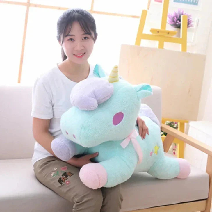 Peluche de unicornio en tonos pastel