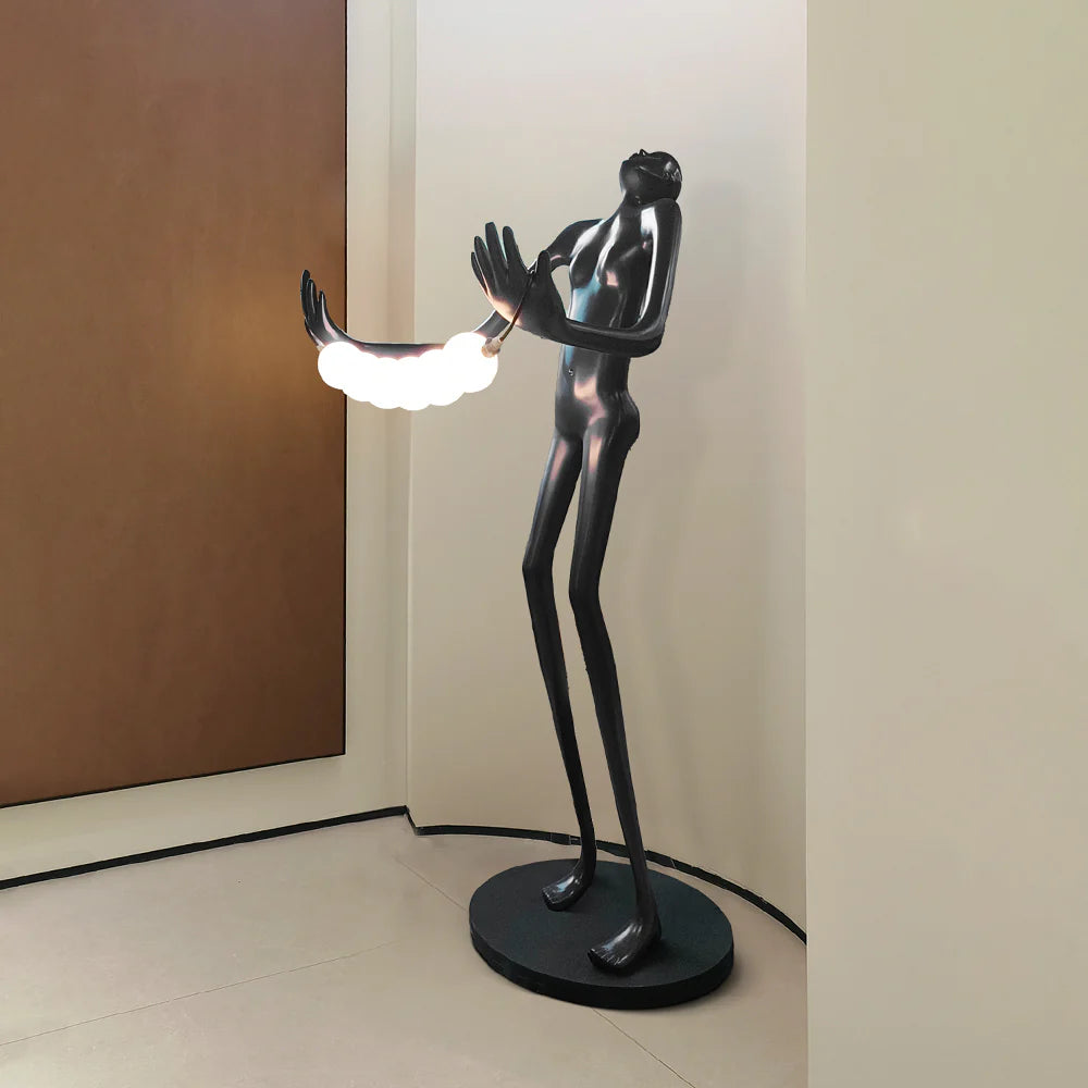 Lámpara de pie de escultura humana con cabeza inclinada