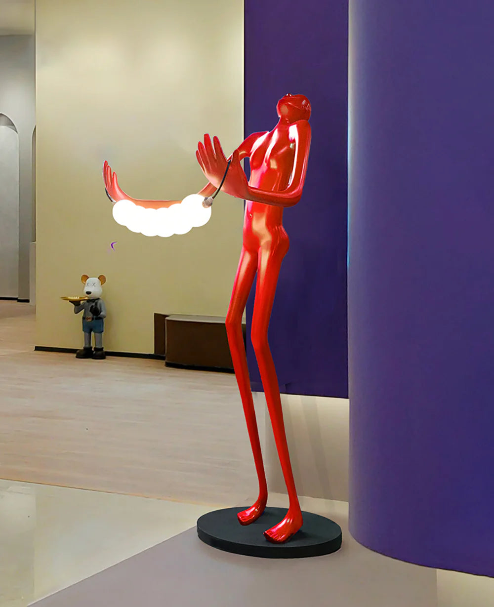 Lámpara de pie de escultura humana con cabeza inclinada