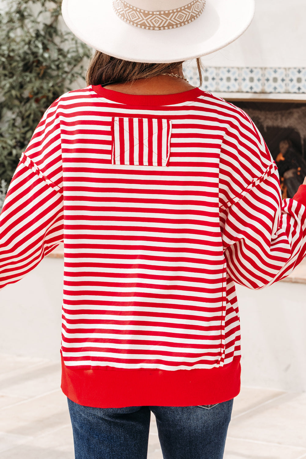 Top tipo jersey casual de hombros caídos con costuras expuestas a rayas naranjas