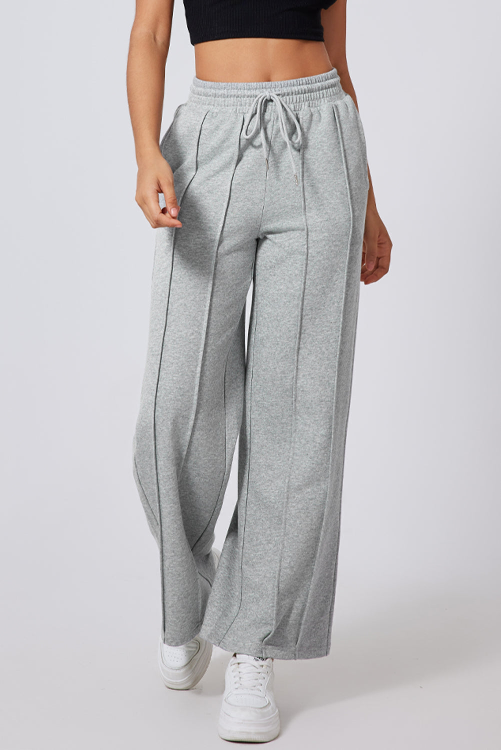 Pantalón de chándal gris de pernera ancha, talle alto, con cordón y costuras