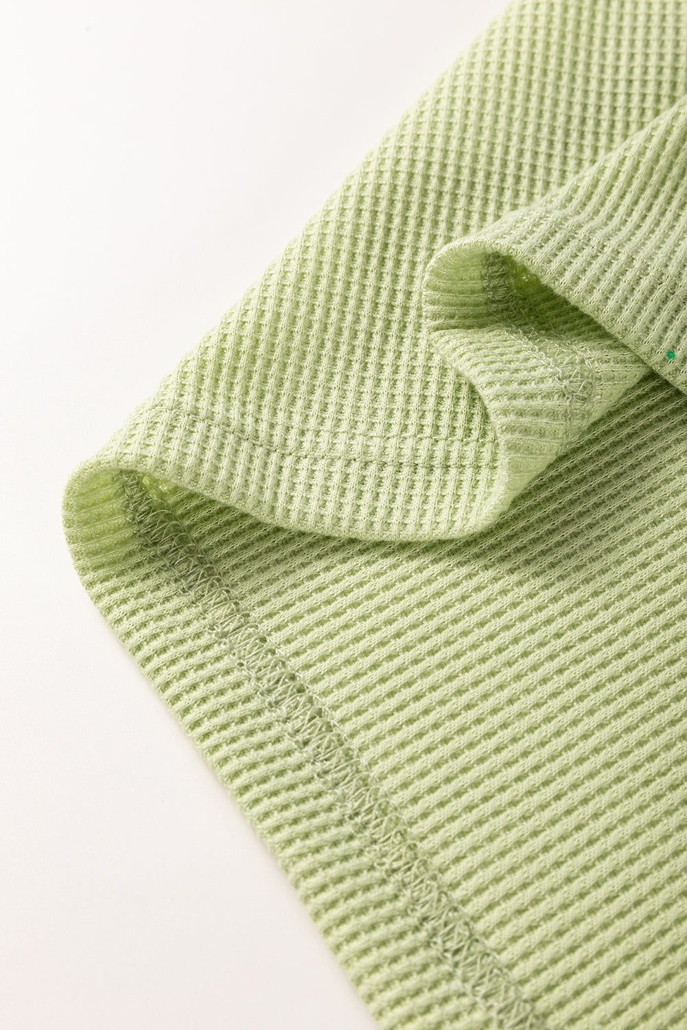 Top de punto colorblock texturizado a rayas patchwork verde menta de manga 3/4