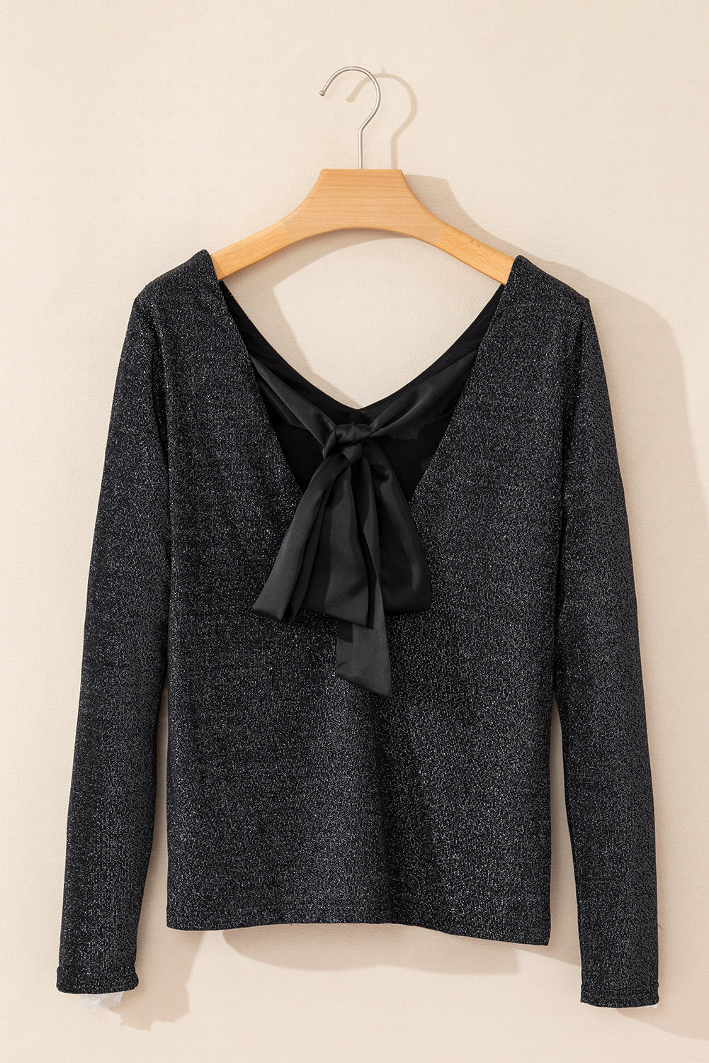 Blusa de manga larga con lazo y cuello en V