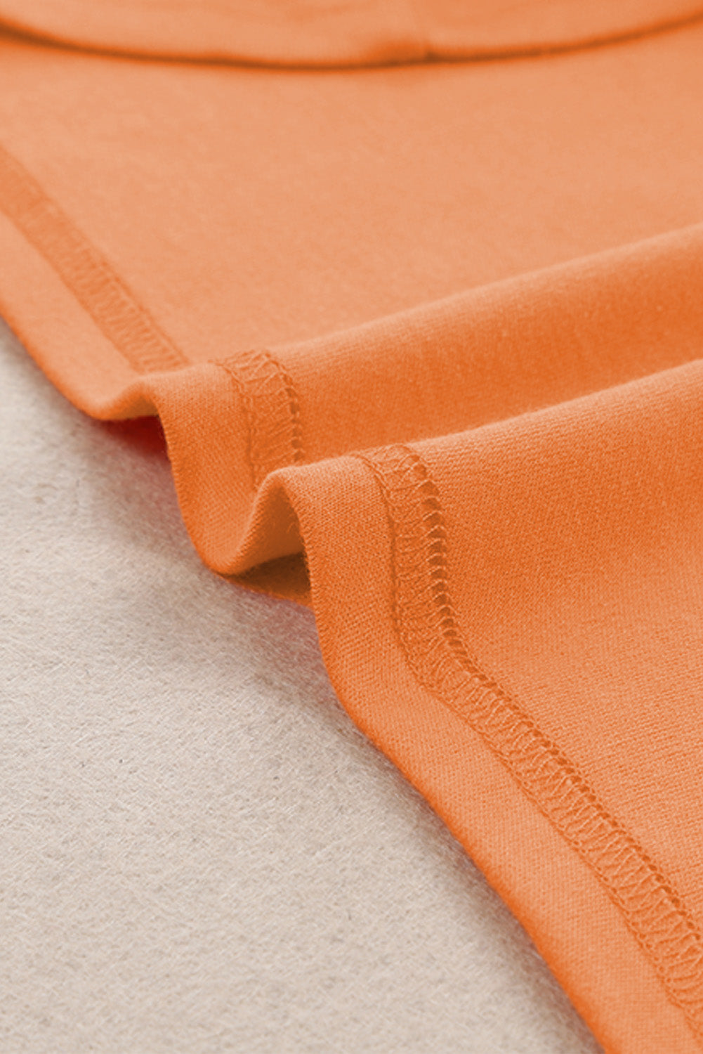 Top naranja liso de manga larga con cuello redondo