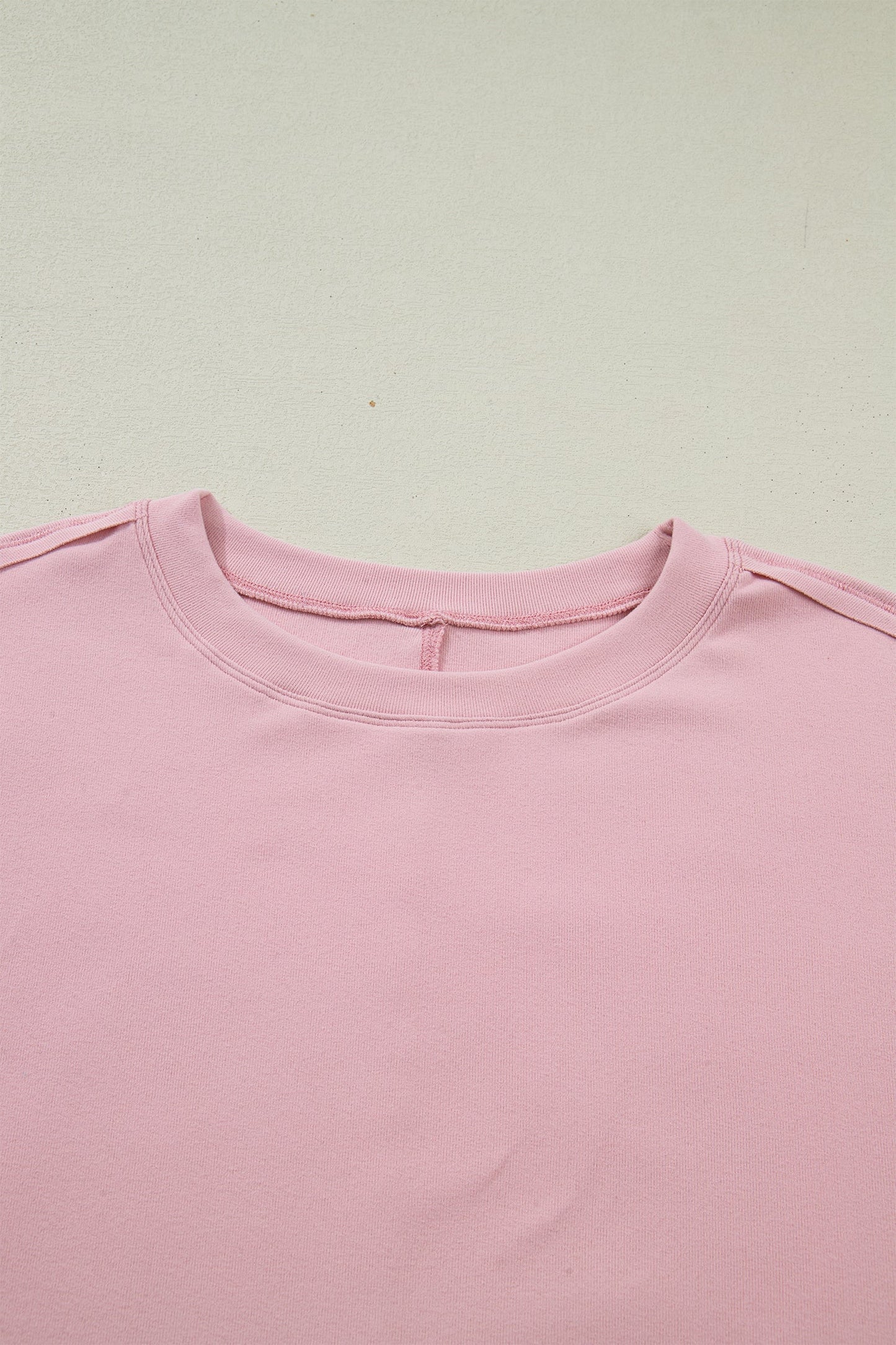 Camiseta de manga larga con retazos texturizados y lazo, color rosa claro liso