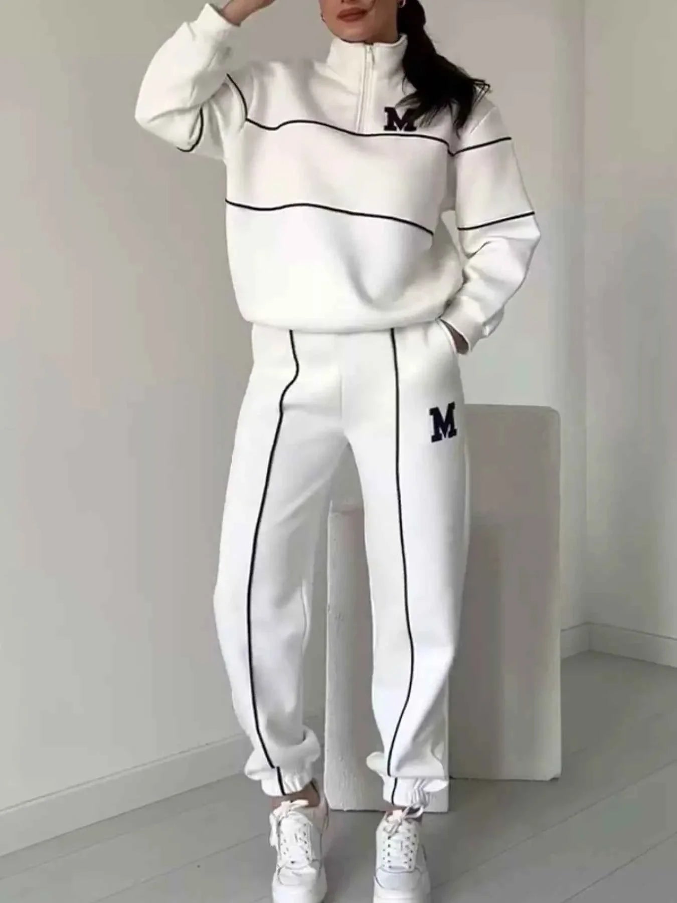 Conjunto de pantalón y top de rayas con cremallera hasta el pecho de talla grande