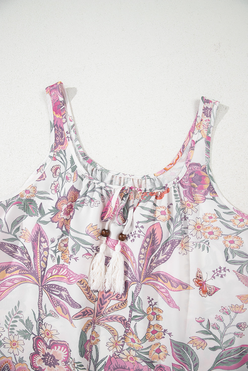 Minivestido sin mangas con cuello de lazo con estampado floral multicolor y flecos