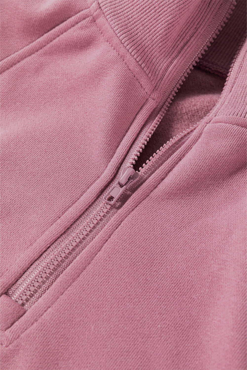 Sudadera lisa fucsia con cremallera y cuello, hombros caídos