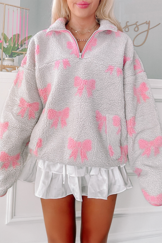 Sudadera holgada gris de sherpa con cremallera de cuarto y patrón de lazo