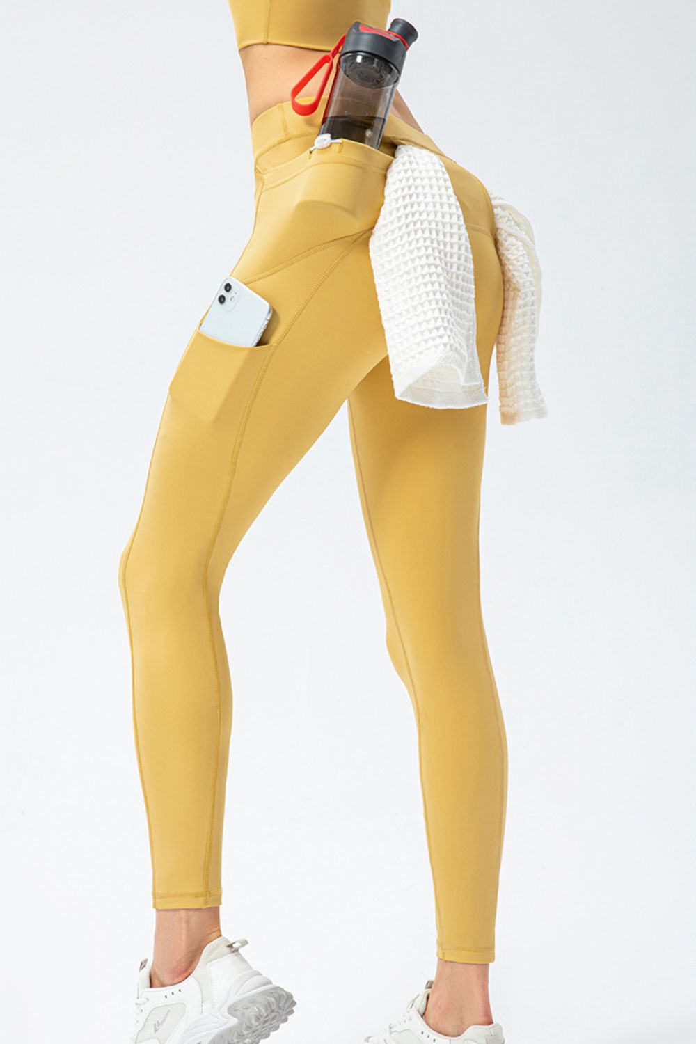 Pantalones deportivos largos de talle alto y corte entallado con bolsillos