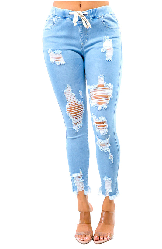 Joggers pitillo de mezclilla clara, tiro alto, con jareta y rotos