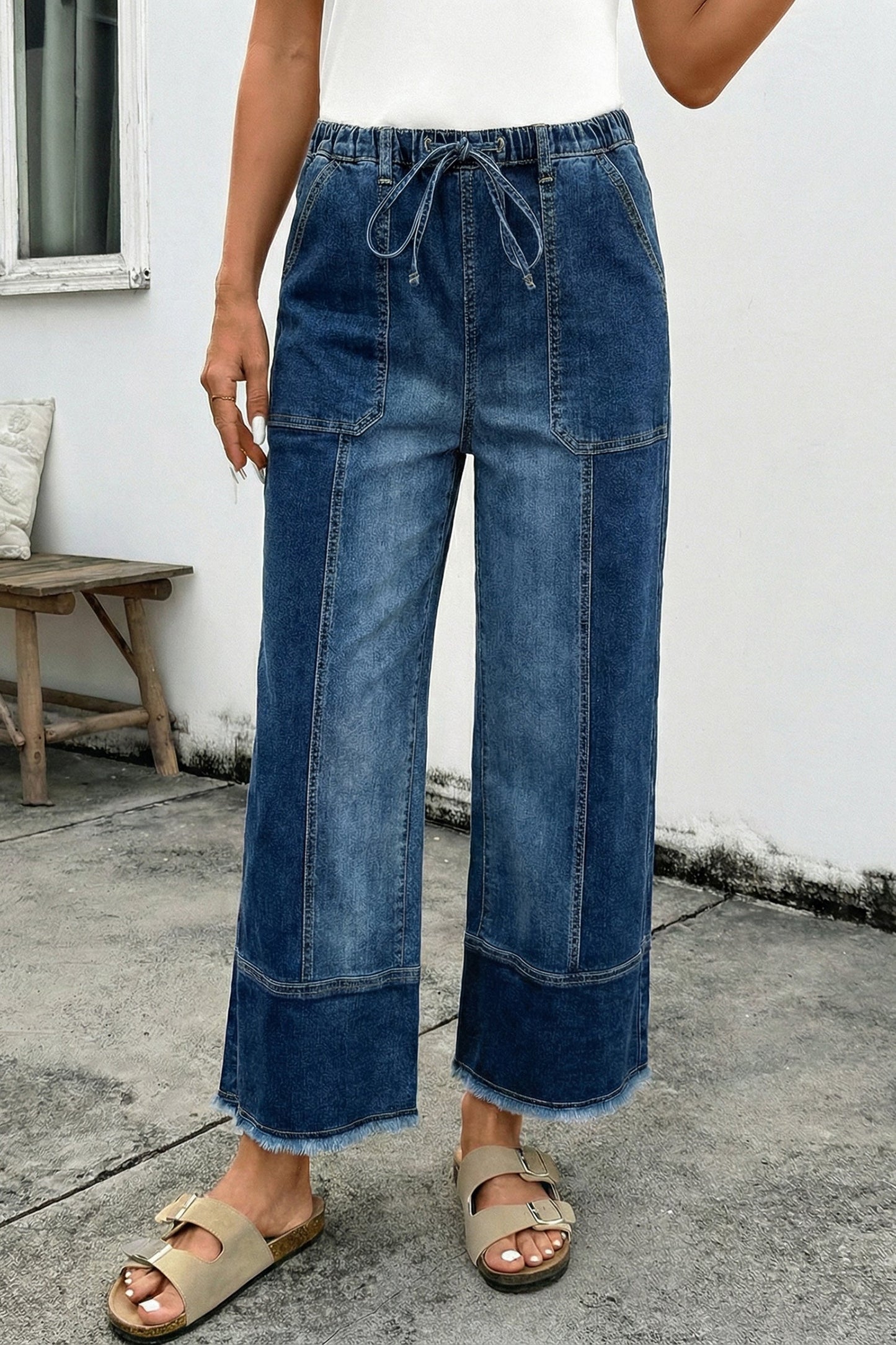 Pantalones vaqueros de pierna ancha con cordón azul de Prusia, detalle de costura y dobladillo sin rematar