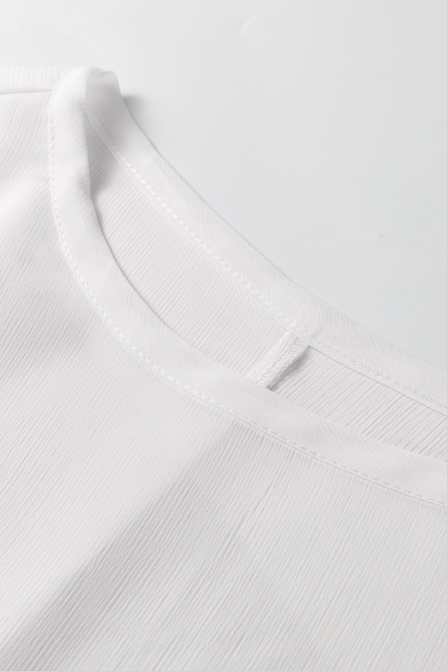 Blusa dolmán de manga larga semitransparente con puños blancos fruncidos