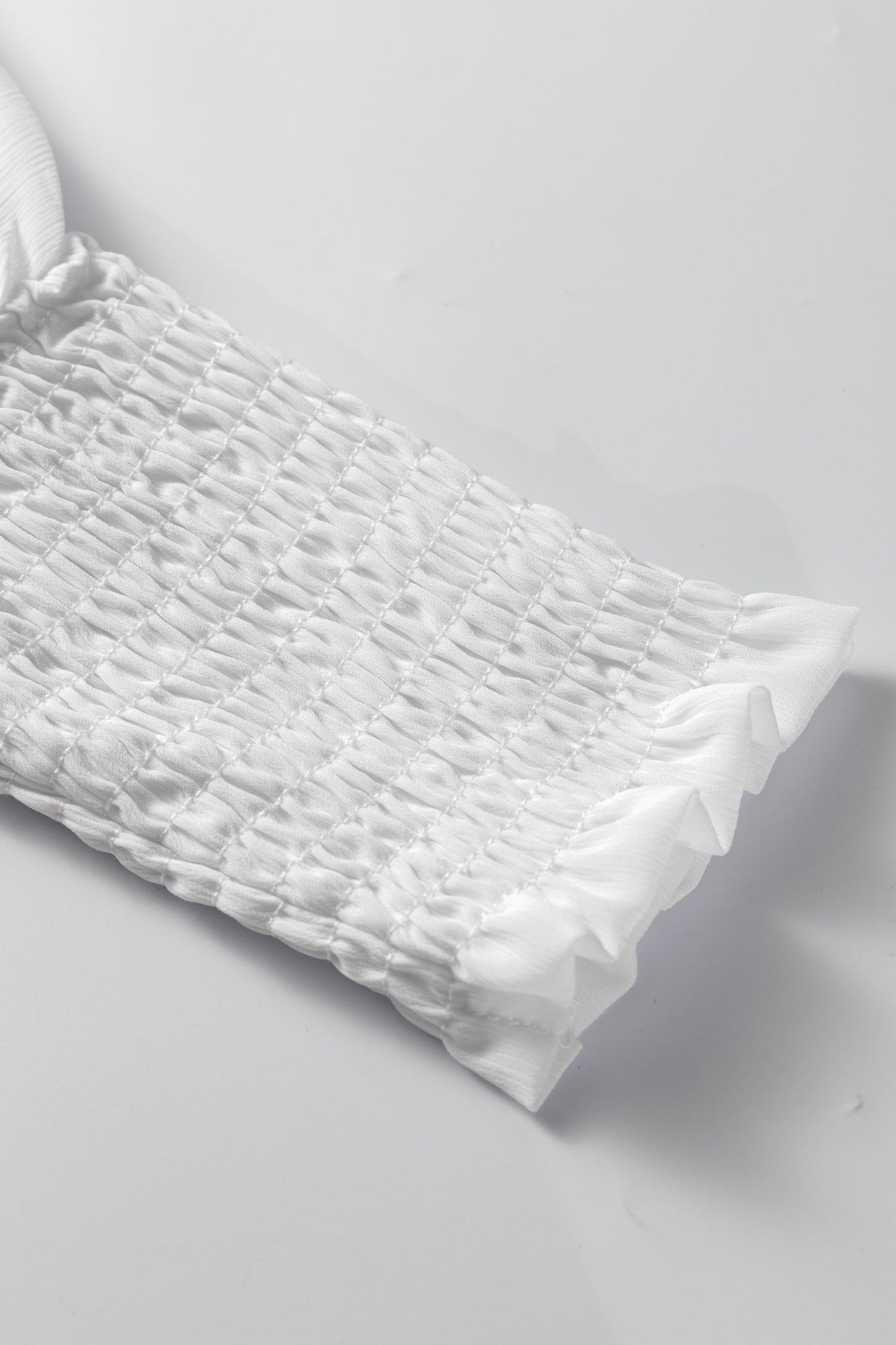 Blusa dolmán de manga larga semitransparente con puños blancos fruncidos