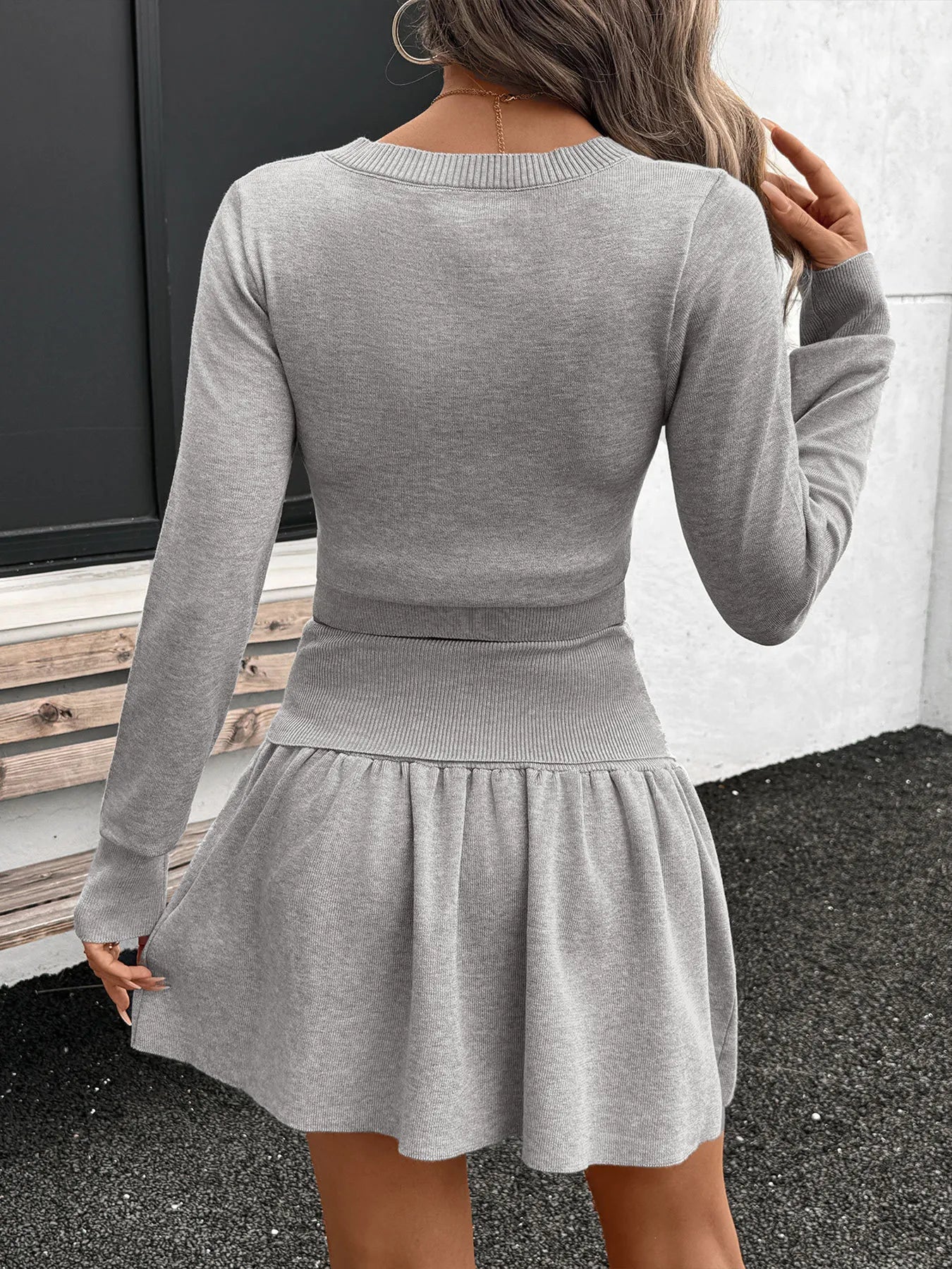 Conjunto de punto de top de manga larga y falda acanalados