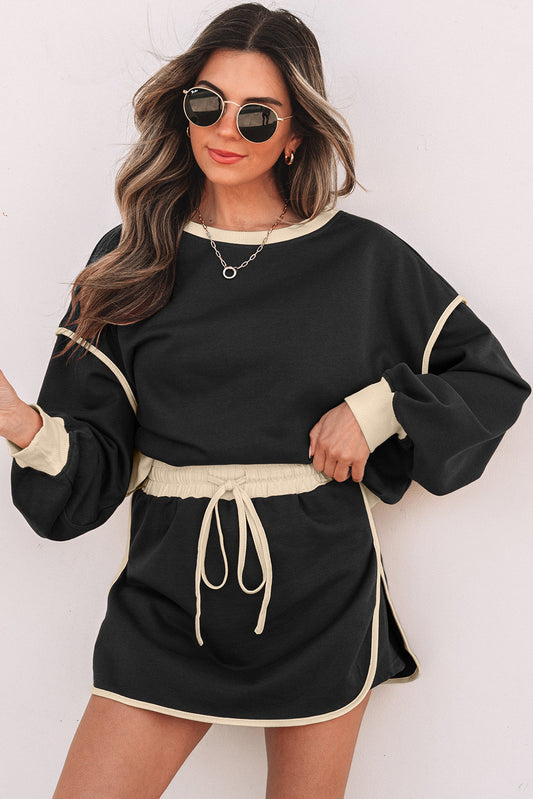 Conjunto de jersey suelto con contraste de color negro y minifalda pantalón con cordones en la cintura