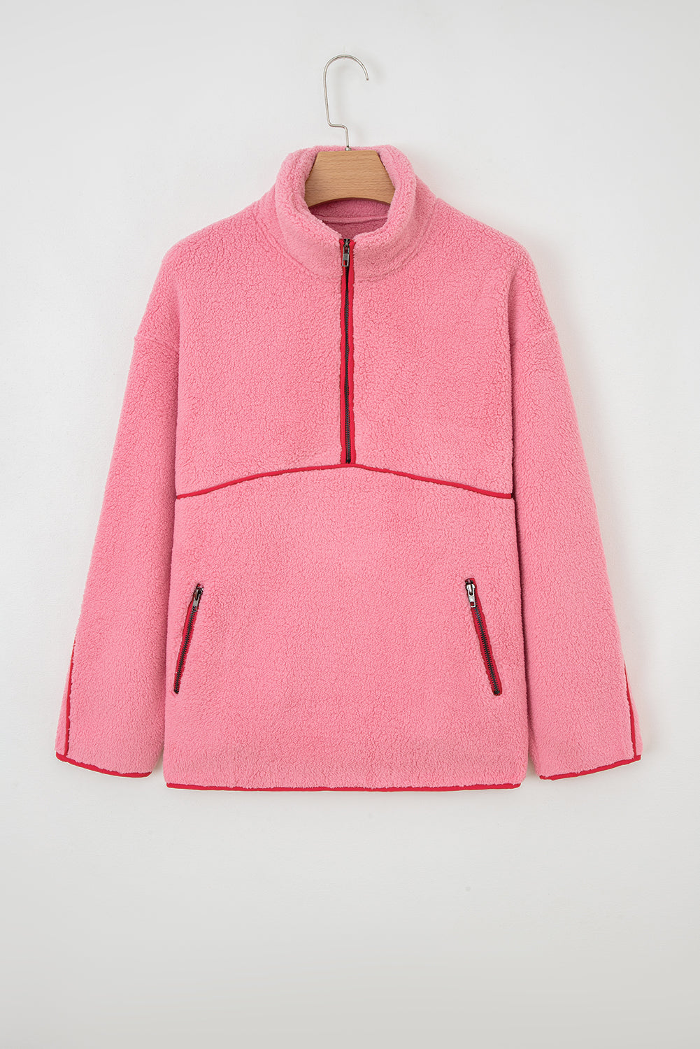 Sudadera de felpa rosa fresa con cremallera corta, detalles de sherpa en contraste y bolsillos con ribete de piel sintética