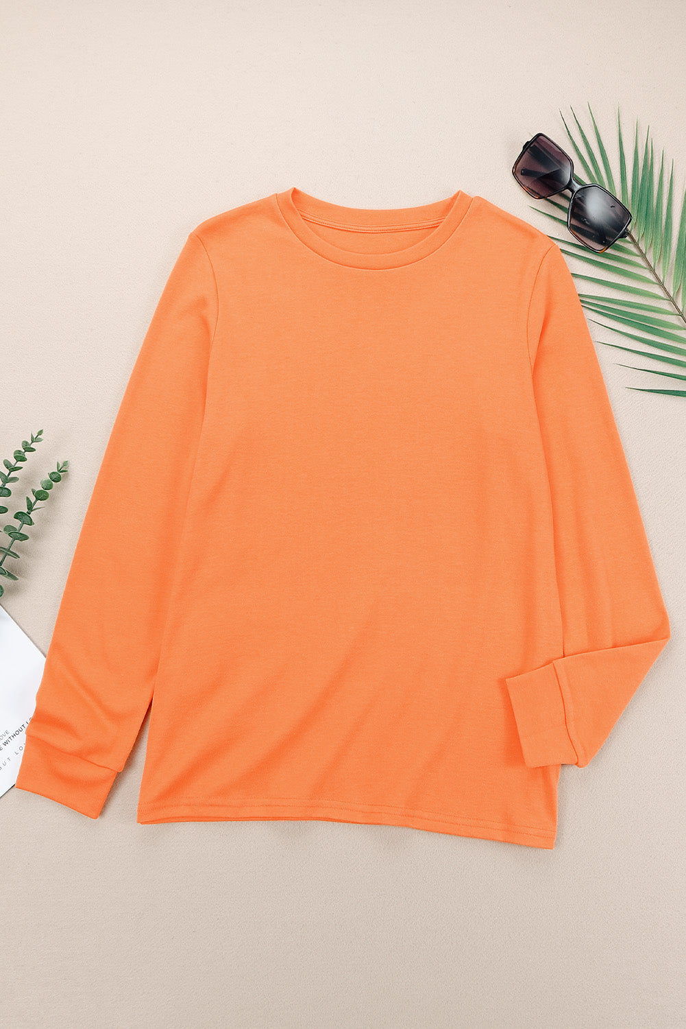 Top naranja liso de manga larga con cuello redondo
