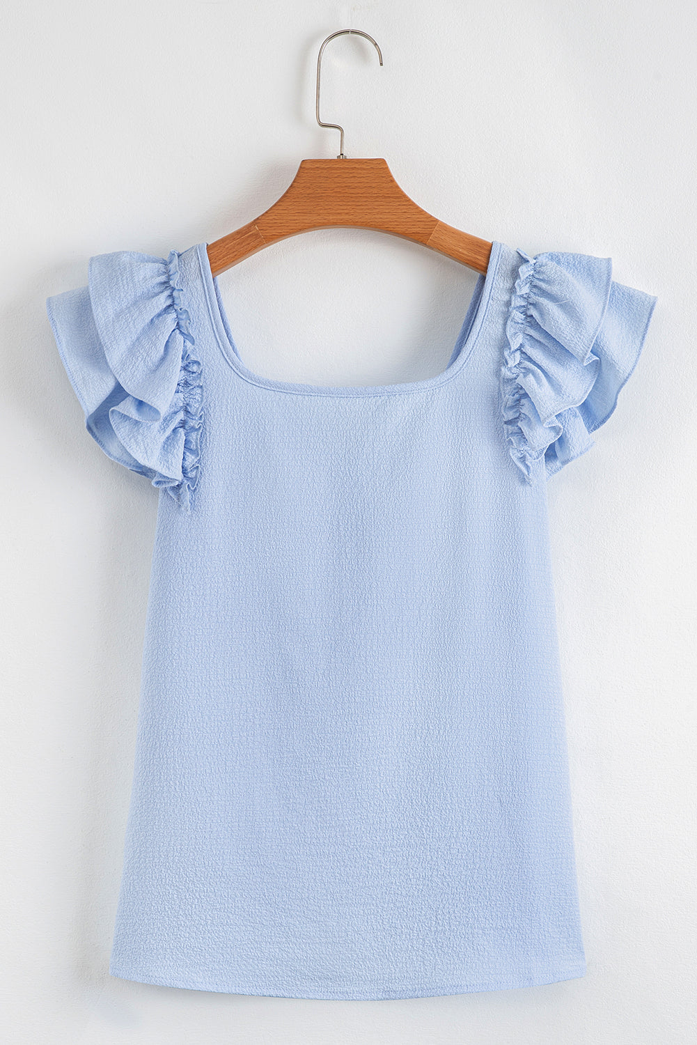 Blusa Beau Blue con mangas mariposa con volantes y nudo de lazo texturizado