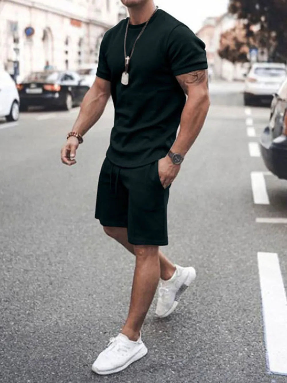 Conjunto de camiseta de manga corta con cuello redondo y pantalones cortos de talla grande para hombre
