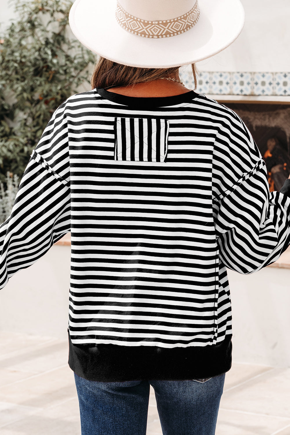 Top tipo jersey casual de hombros caídos con costuras expuestas a rayas naranjas