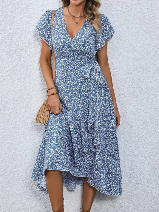 Vestido midi cruzado con estampado floral y bajo con volantes