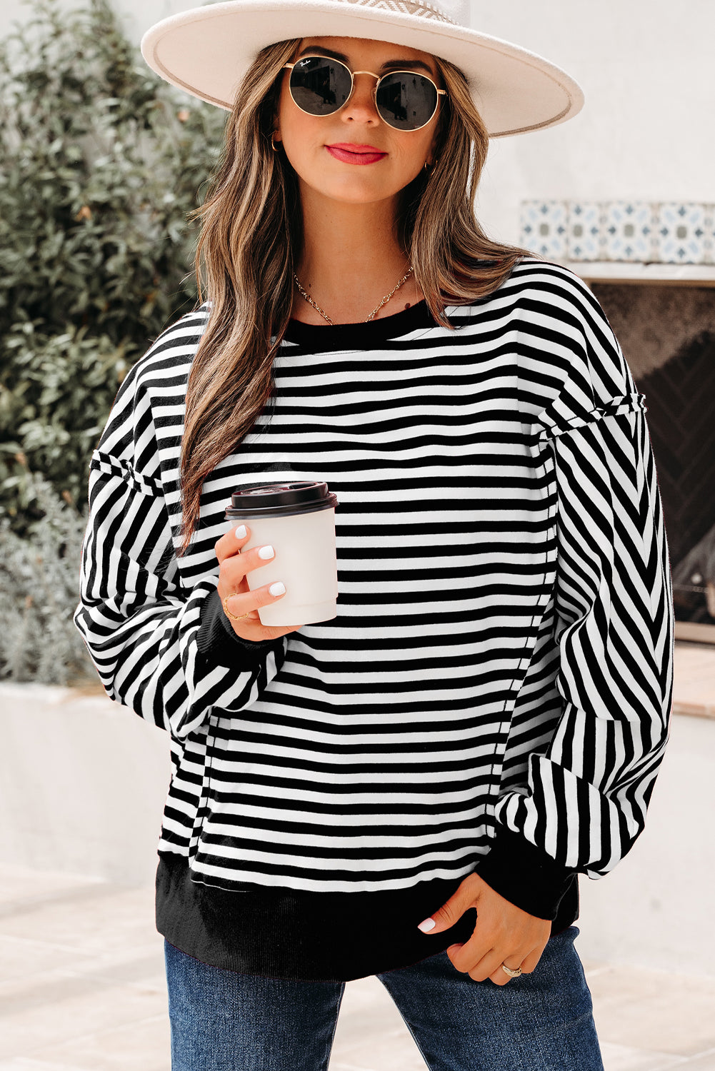 Top tipo jersey casual de hombros caídos con costuras expuestas a rayas naranjas