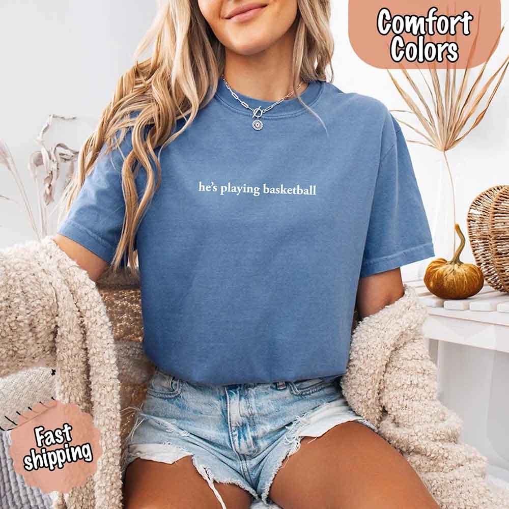 He’s Playing Basketball – Funny Sports Girlfriend Comfort Colors Shirt for Women