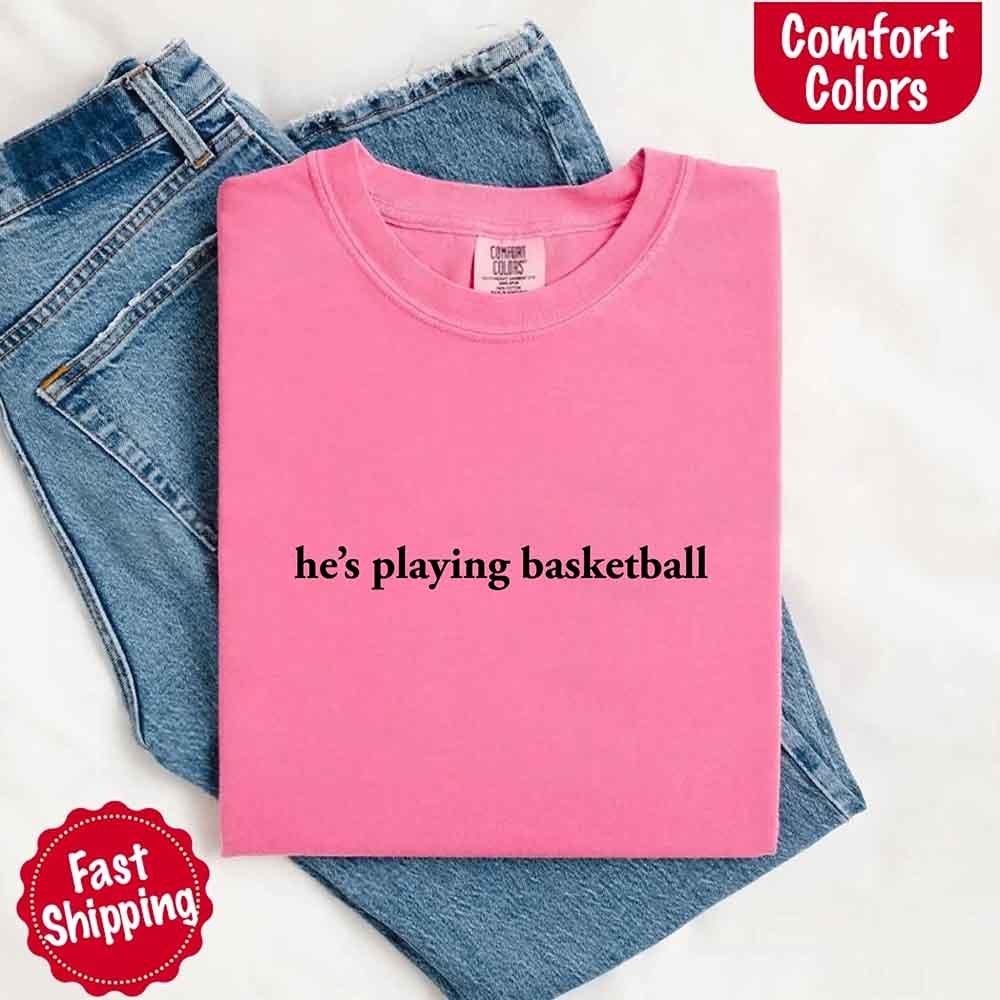 He’s Playing Basketball – Funny Sports Girlfriend Comfort Colors Shirt for Women