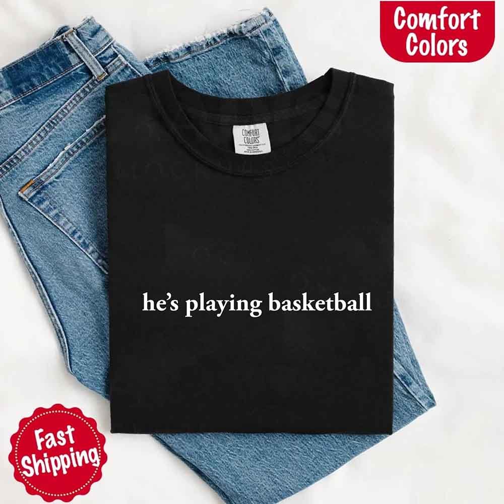 He’s Playing Basketball – Funny Sports Girlfriend Comfort Colors Shirt for Women