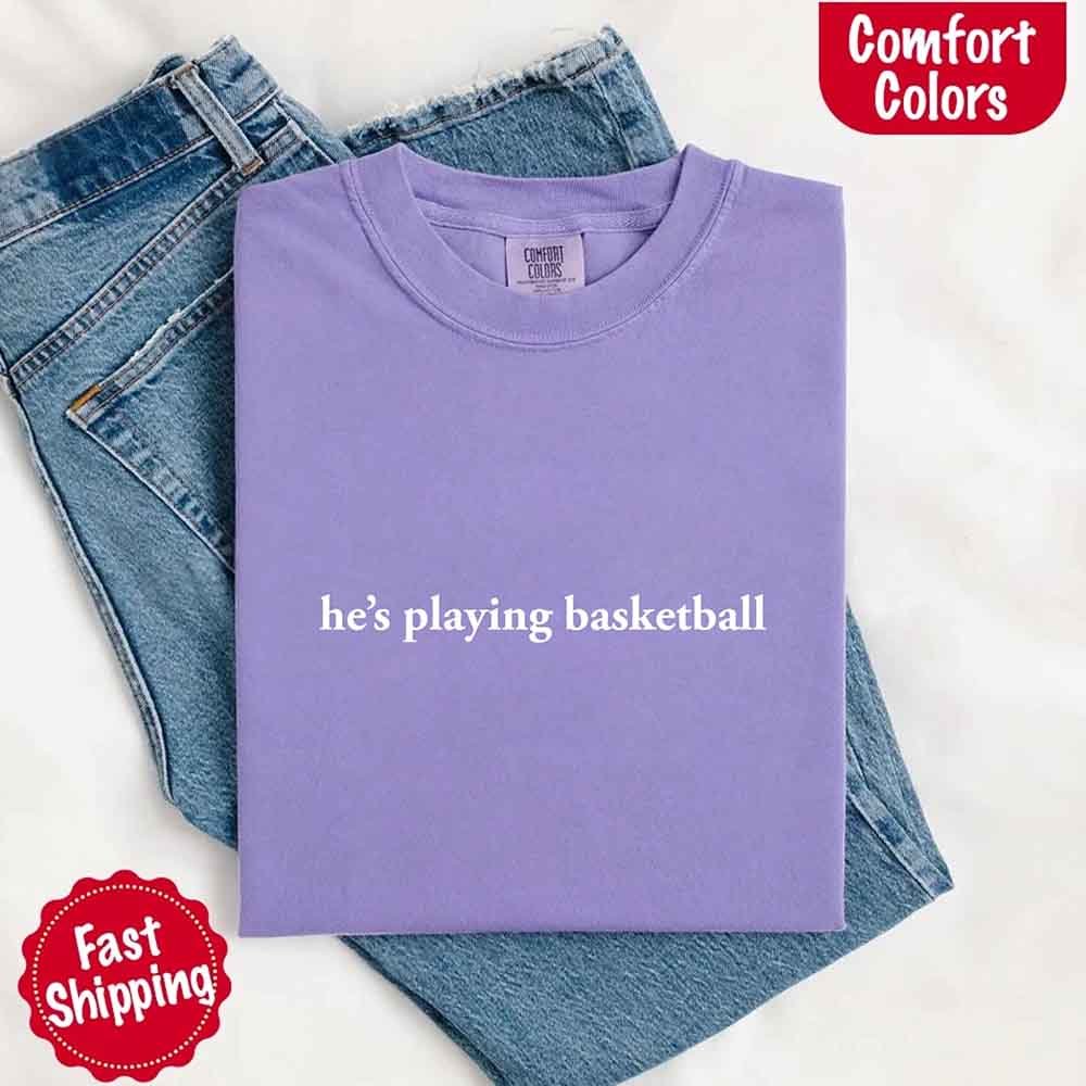He’s Playing Basketball – Funny Sports Girlfriend Comfort Colors Shirt for Women